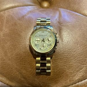 Gold tone Michael Kors watch.